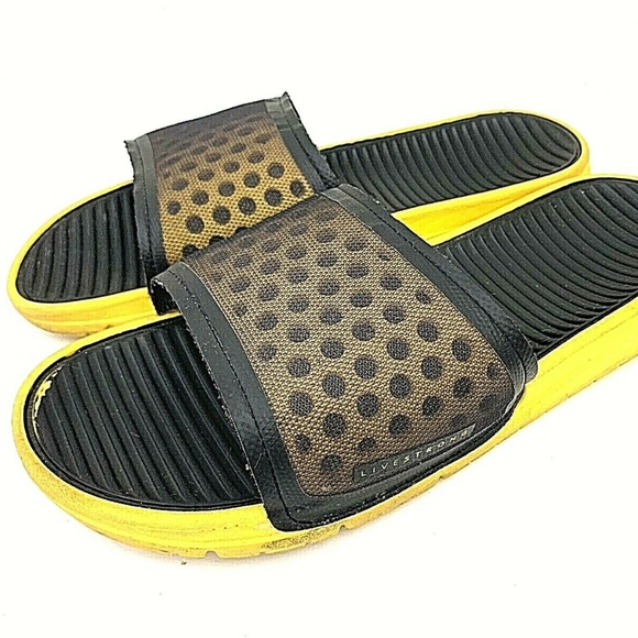 yellow and black nike slides
